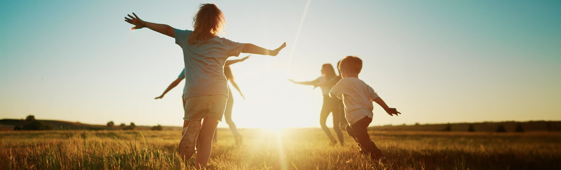 Children running through field