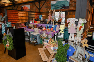 Items on display for the Live Auction at the 2026 EHFAR Fundraiser, For the Love of Perry Kids