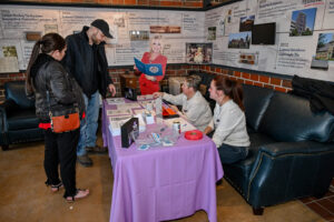 Guests check-in at the 2026 EHFAR Fundraiser, For the Love of Perry Kids