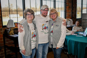 EHFAR Co-Chairs Ann Hankinson and Jeanette Addington with Live Auctioneer Jeremy Seals at the 2026 EHFAR For the Love of Kids Fundraiser.
