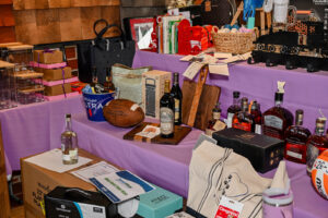 Array of Live Auction items on display at the 2026 EHFAR Fundraiser, For the Love of Perry Kids