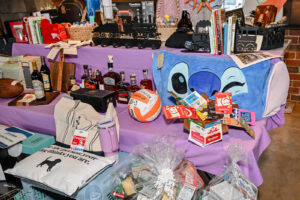 Array of Live Auction items on display at the 2026 EHFAR Fundraiser, For the Love of Perry Kids