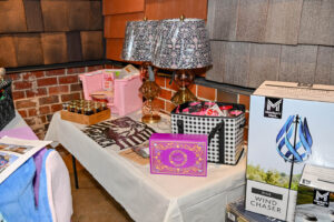Array of Live Auction items on display at the 2026 EHFAR Fundraiser, For the Love of Perry Kids
