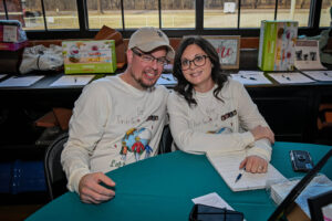 Live Auctioneer Jeremy Seals and his wife at the 2026 EHFAR Fundraiser, For the Love of Perry Kids