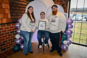 Madeline Holden and her parents. Madeline designed the event t-shirts and won a $50 Amazon gift card. The family was in attendance for the 2026 EHFAR For the Love of Kids Fundraiser.