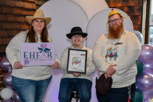 Madeline Holden and her parents. Madeline designed the event t-shirts and won a $50 Amazon gift card. The family was in attendance for the 2026 EHFAR For the Love of Kids Fundraiser.
