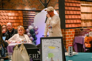 Auctioneer Jeremy Seals taking bids in the Live Auction at the 2026 EHFAR For the Love of Kids Fundraiser.