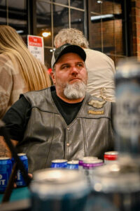 Member of the New Lex Classic Riders watching the Live Auction at the 2026 EHFAR For the Love of Kids Fundraiser.