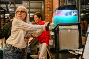 Bartender Michelle Hale pulling a special slushie machine event cocktail at the 2026 EHFAR For the Love of Kids Fundraiser.