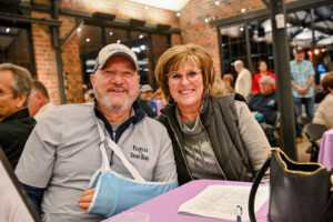 Guests at the Peoples Bank Table enjoying the fun at the 2026 EHFAR For the Love of Kids Fundraiser at the Factory of Ideas at Ludowici Tile Plant.