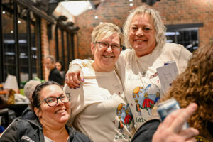 Volunteers in their event T-Shirts at the 2026 EHFAR For the Love of Kids Fundraiser at the Factory of Ideas at Ludowici Tile Plant.
