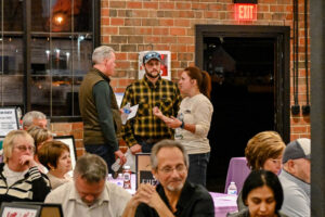 Leah Sowers and husband connecting with a guest at the 2026 EHFAR For the Love of Kids Fundraiser.