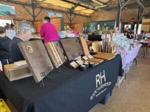 Local woodworker Rustic Hardwoods selling cutting boards and board care products at the Ludowici Farmers Market at the Factory of Ideas in New Lexington, Ohio.