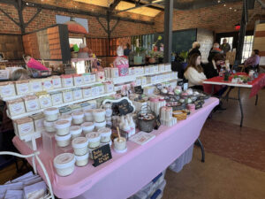 Local maker selling personal care goods at the Ludowici Farmers Market at the Factory of Ideas in New Lexington, Ohio.