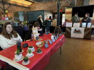 Local maker selling succulents and personal care products at the Ludowici Farmers Market at the Factory of Ideas in New Lexington, Ohio.