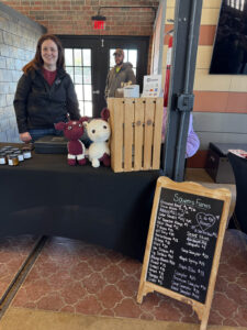 Ludowici Farmers Market Organizer Leah Sowers and her husband at their Market booth selling meats beef tallow products.