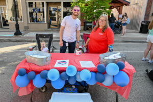 The Perry County Community Club table on Main Street in New Lexington during the 2026 Chalk It Up to Summer event for kids and families.