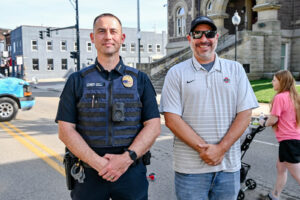 New Lexington Police Chief Doug Gill on Main Street in New Lexington during the 2026 Chalk It Up to Summer event for kids and families.