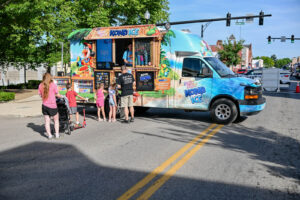 The KONA Ice truck on Main Street in New Lexington during the 2026 Chalk It Up to Summer event for kids and families.